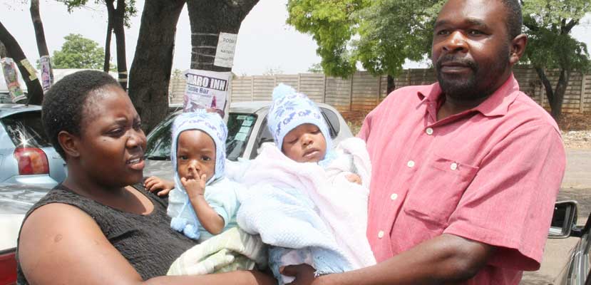 Kupakwashe and Tapiwanashe Chitigo with their parents. Pic: The Herald