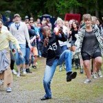 Blessing palying the cowbell at the Stubbertopert Festival in Norway