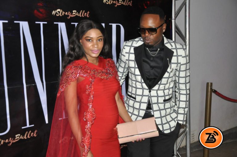 Pregnant Dyonne reveals baby bump in a Mini Bandage Dress